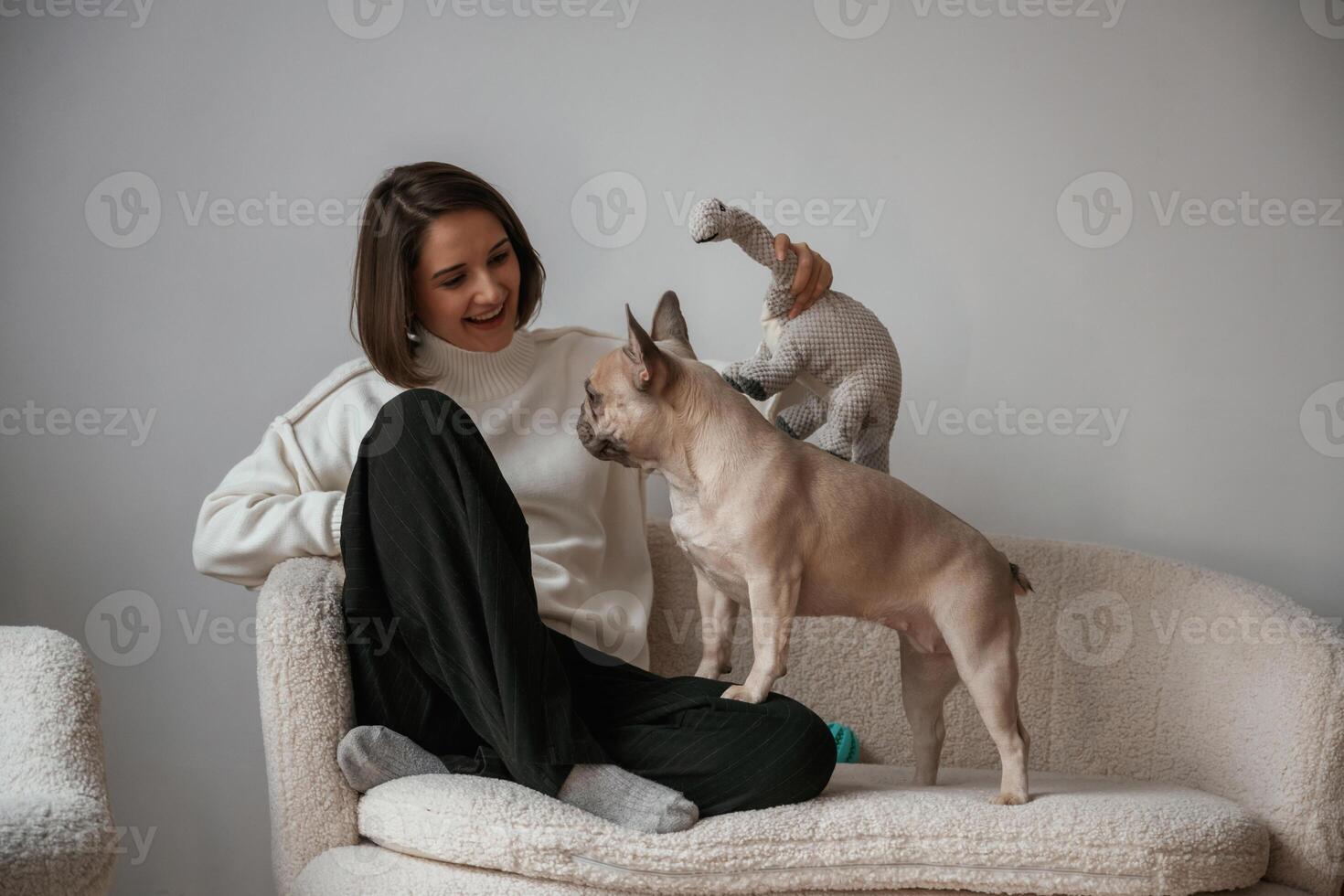 Conception, of love and care. Young woman is with her pug dog at home photo