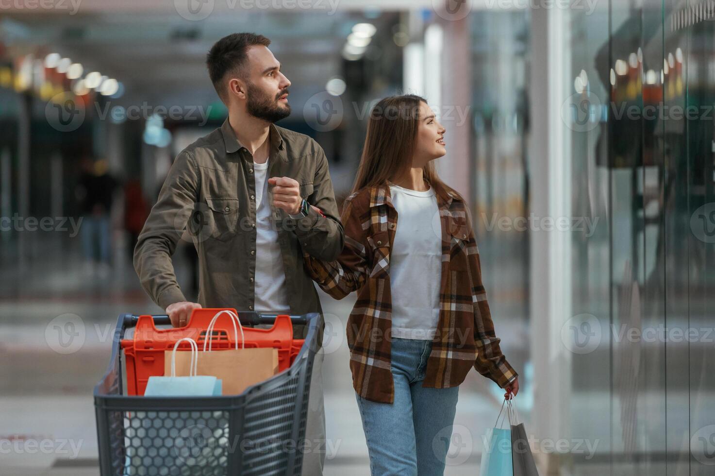 Positive ,emotions. Young ,couple, are in supermarket together photo