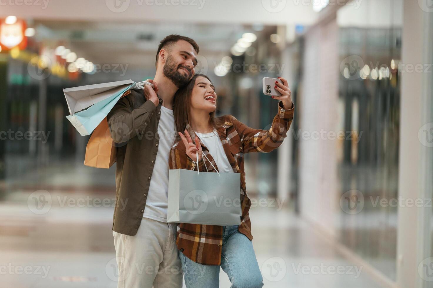 Making selfie. Young couple are in ,supermarket together photo