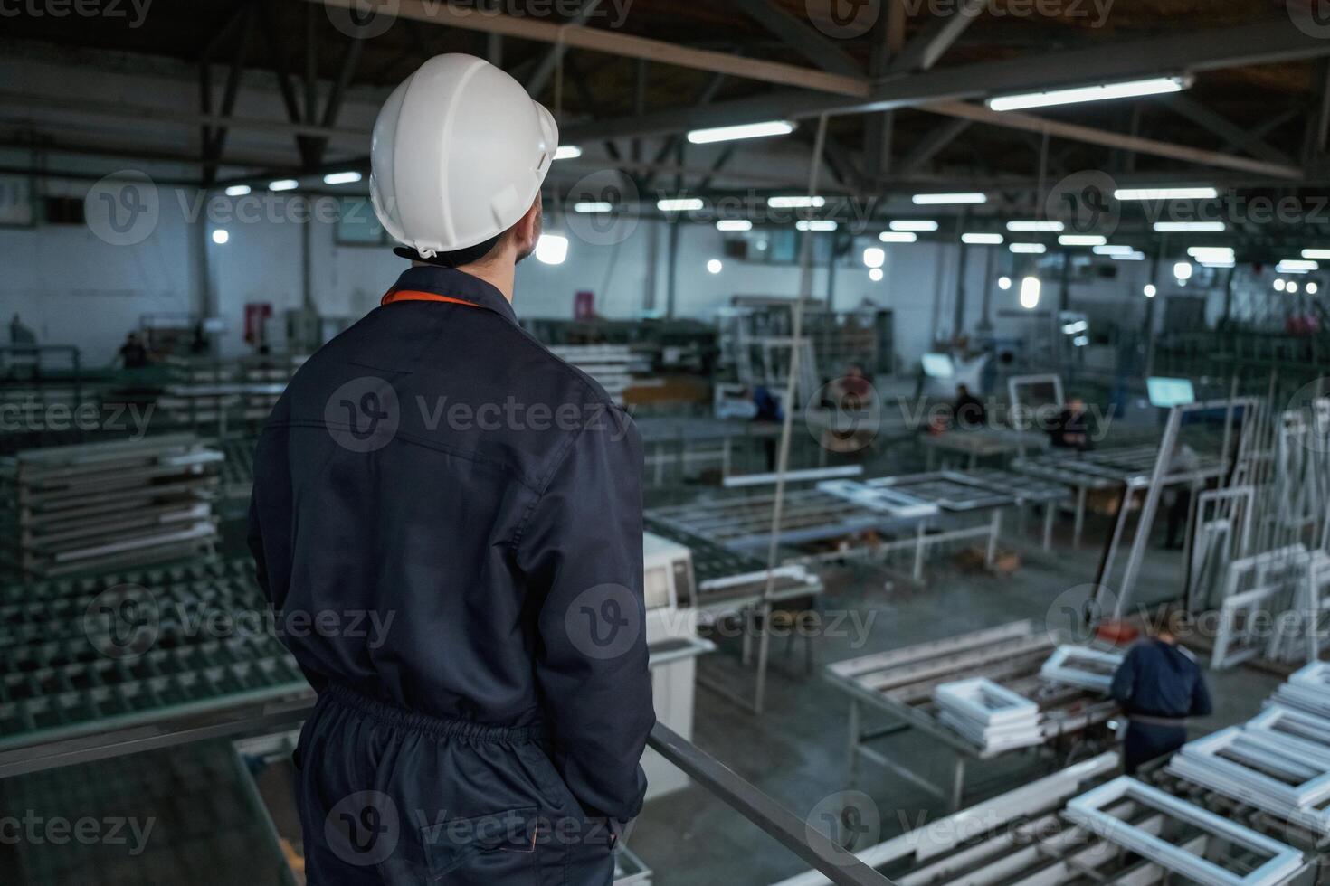 Quality, control. Factory ,worker is indoors with hard hat photo
