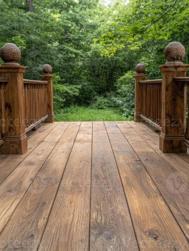Wooden deck overlooking a lush green forest photo