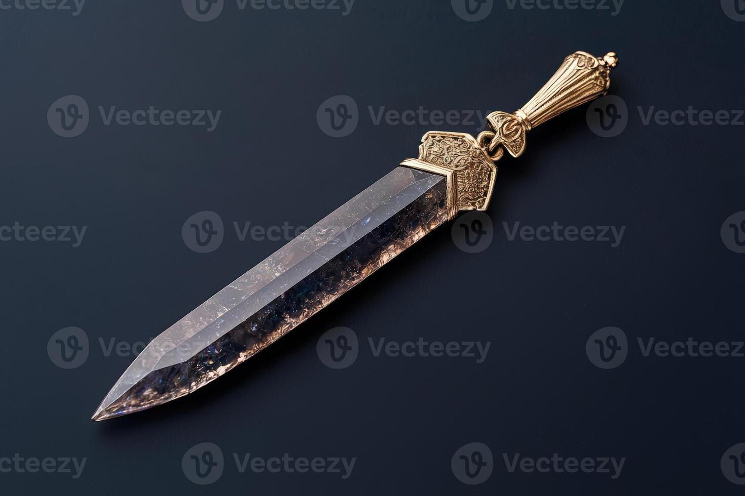 Ornate gold dagger with a crystal blade photo