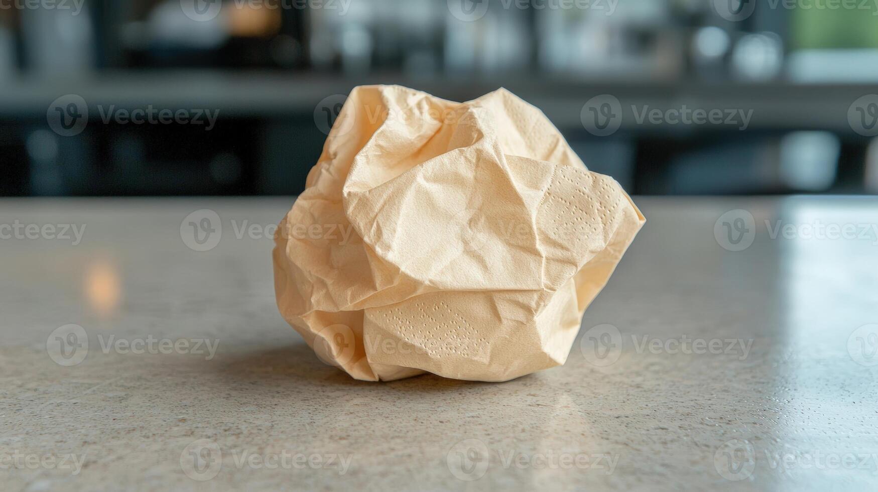 Crumpled beige napkin on a table photo