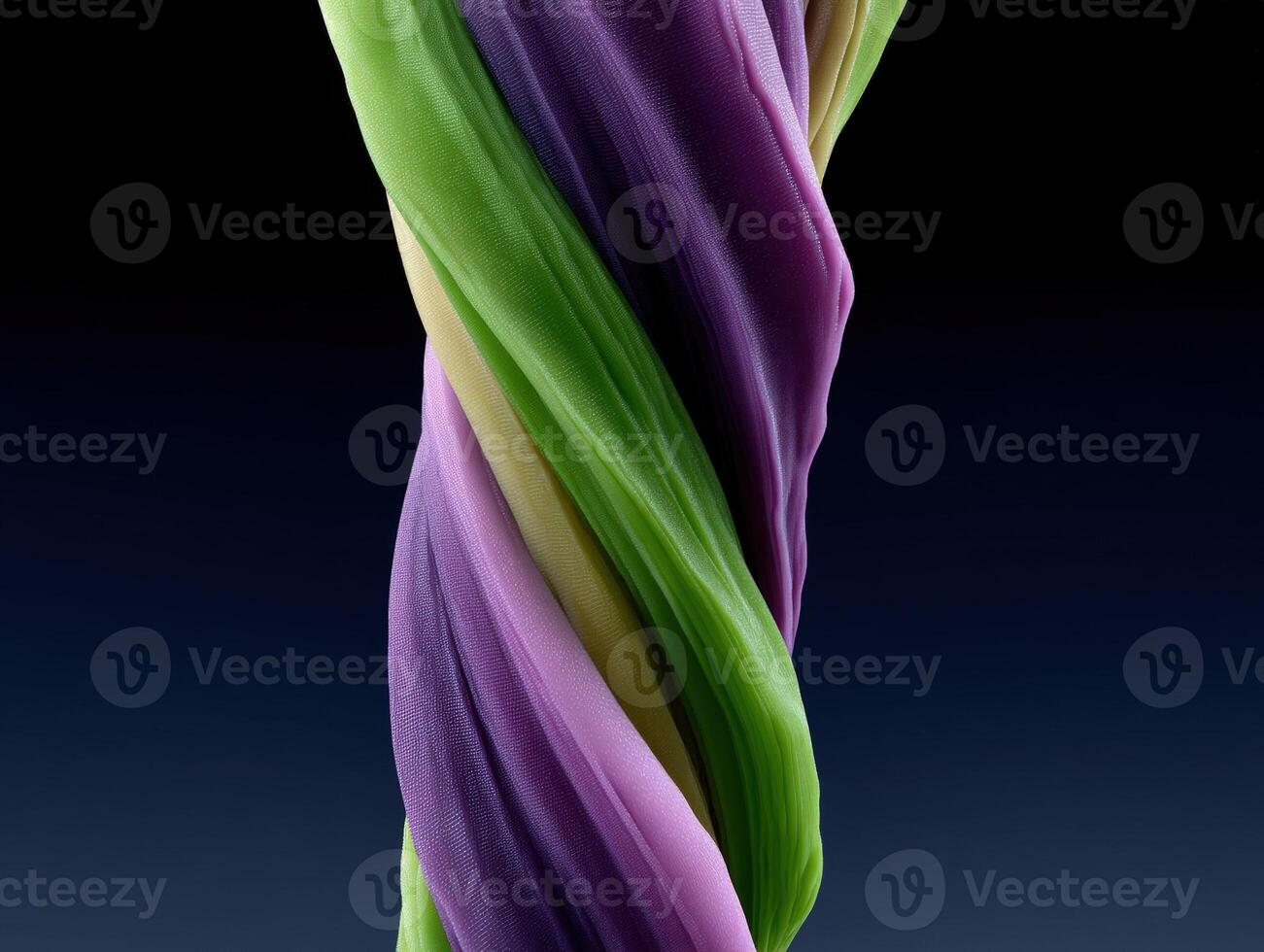 Twisted colorful fabric on a dark background photo