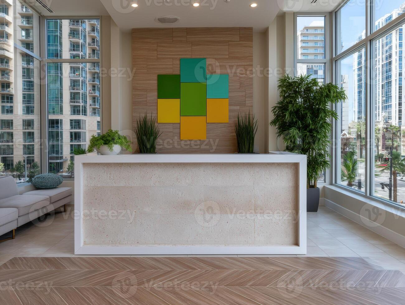 Modern lobby area with reception desk and city views photo