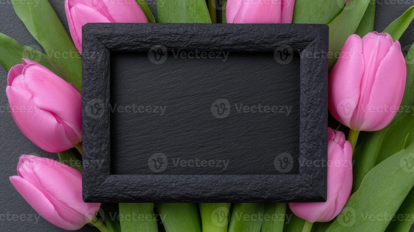 Pink tulips with a blank black frame photo