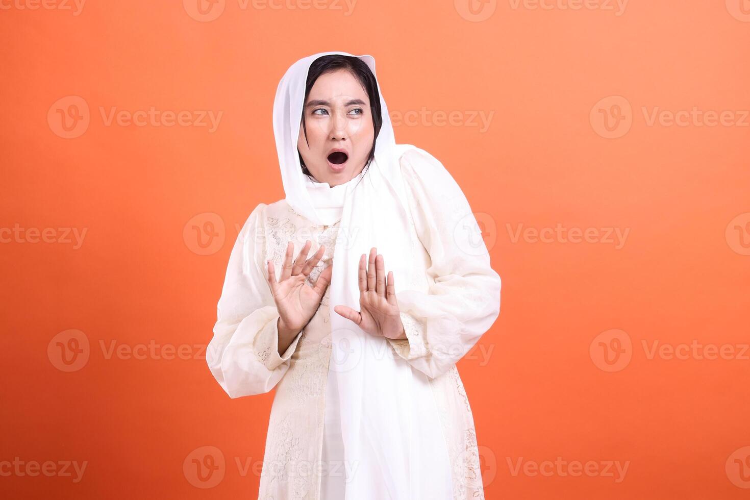 Startled Expression, Woman in hijab, conveying shock or surprise photo