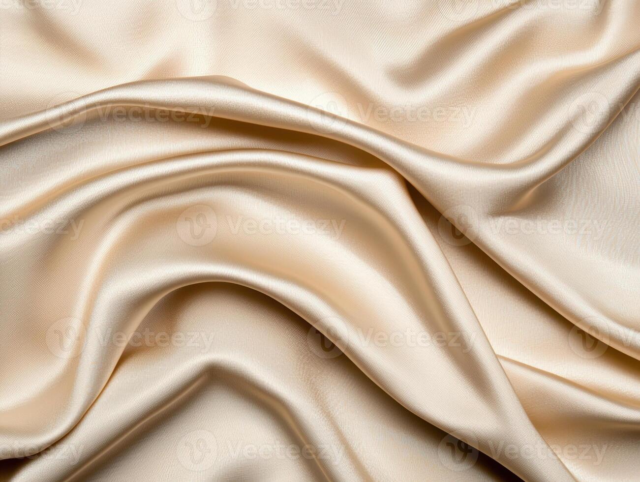 Elegant draped golden silk fabric with soft, flowing folds photo