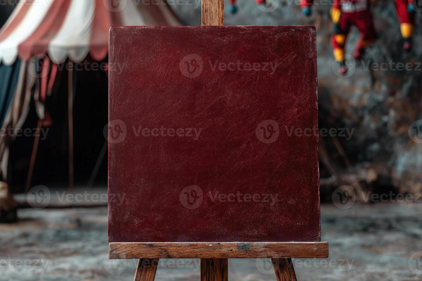Rustic maroon canvas on wooden easel, circus backdrop photo