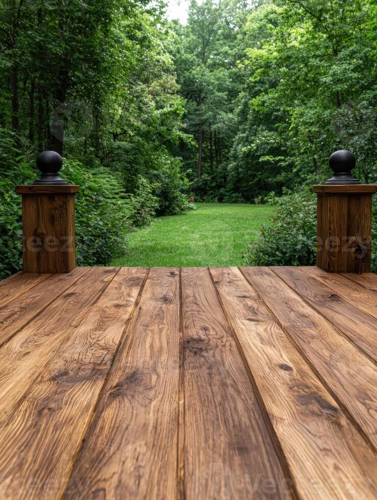 Wooden deck overlooking a lush green forest landscape photo