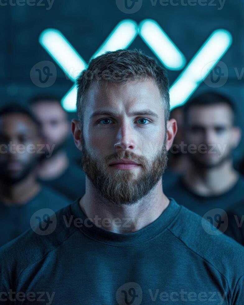 Intense portrait of a bearded man with piercing blue eyes photo