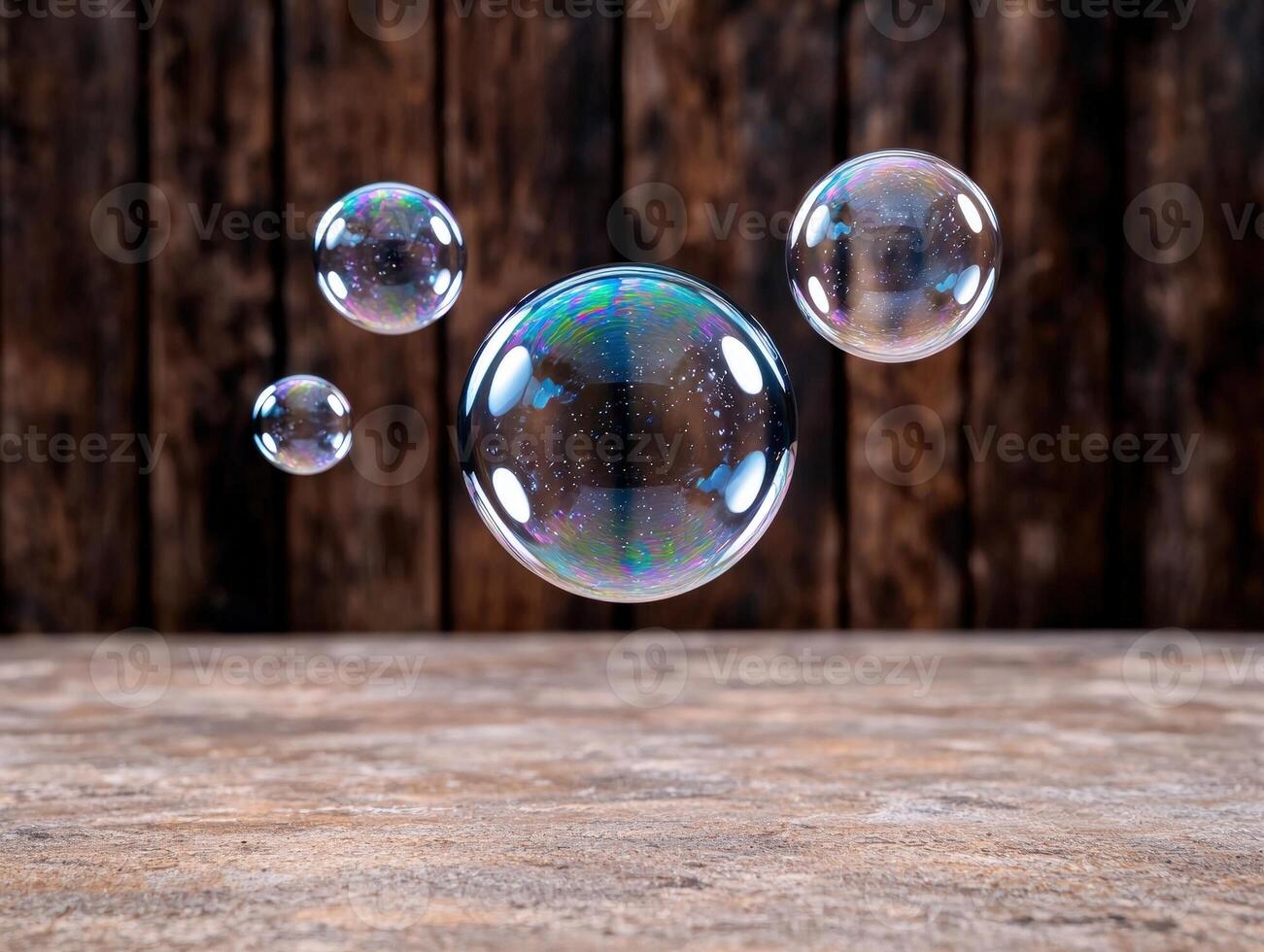 Floating iridescent soap bubbles against a rustic wooden background photo