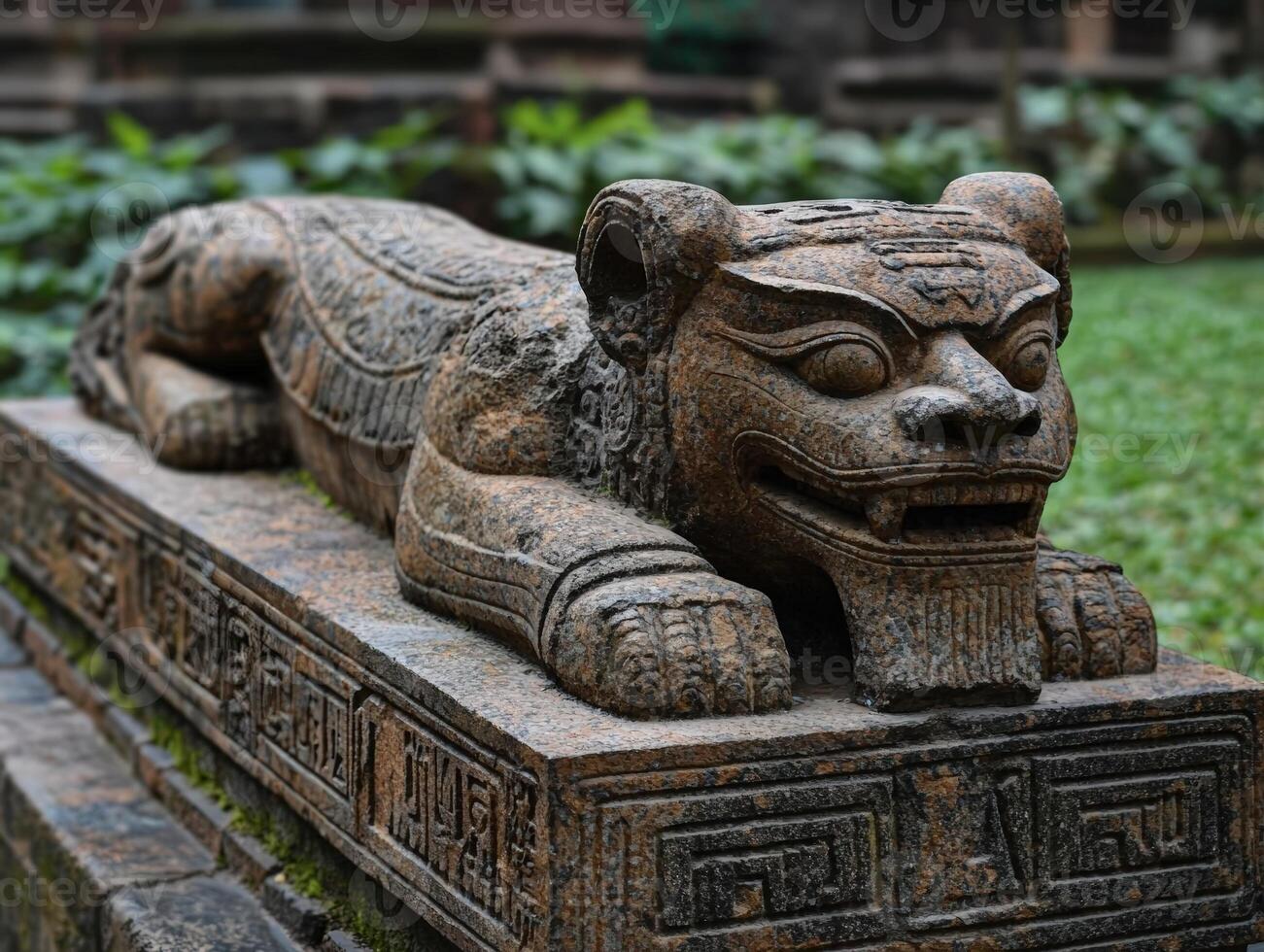 Ancient stone lion statue with intricate details and texture photo