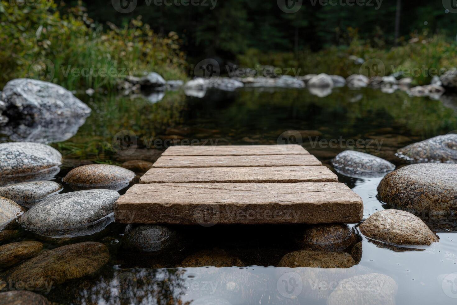 Rustic wooden plank bridge crosses a tranquil stream photo