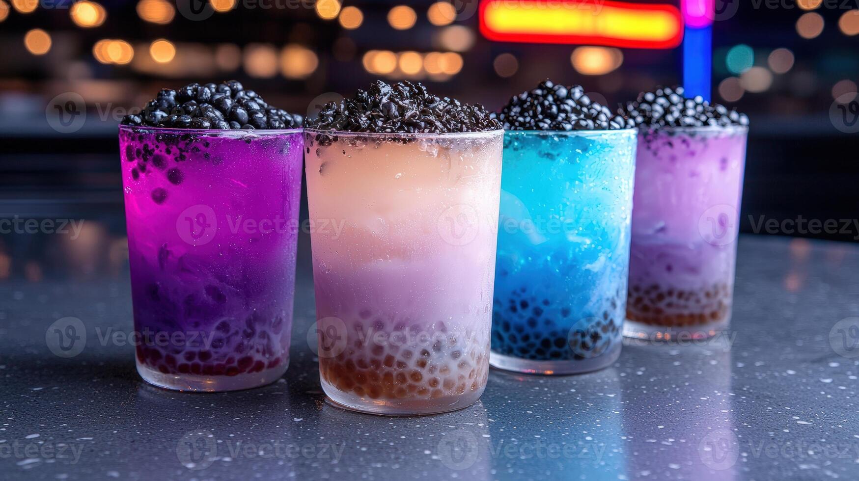 Colorful boba drinks with tapioca pearls on a bar photo