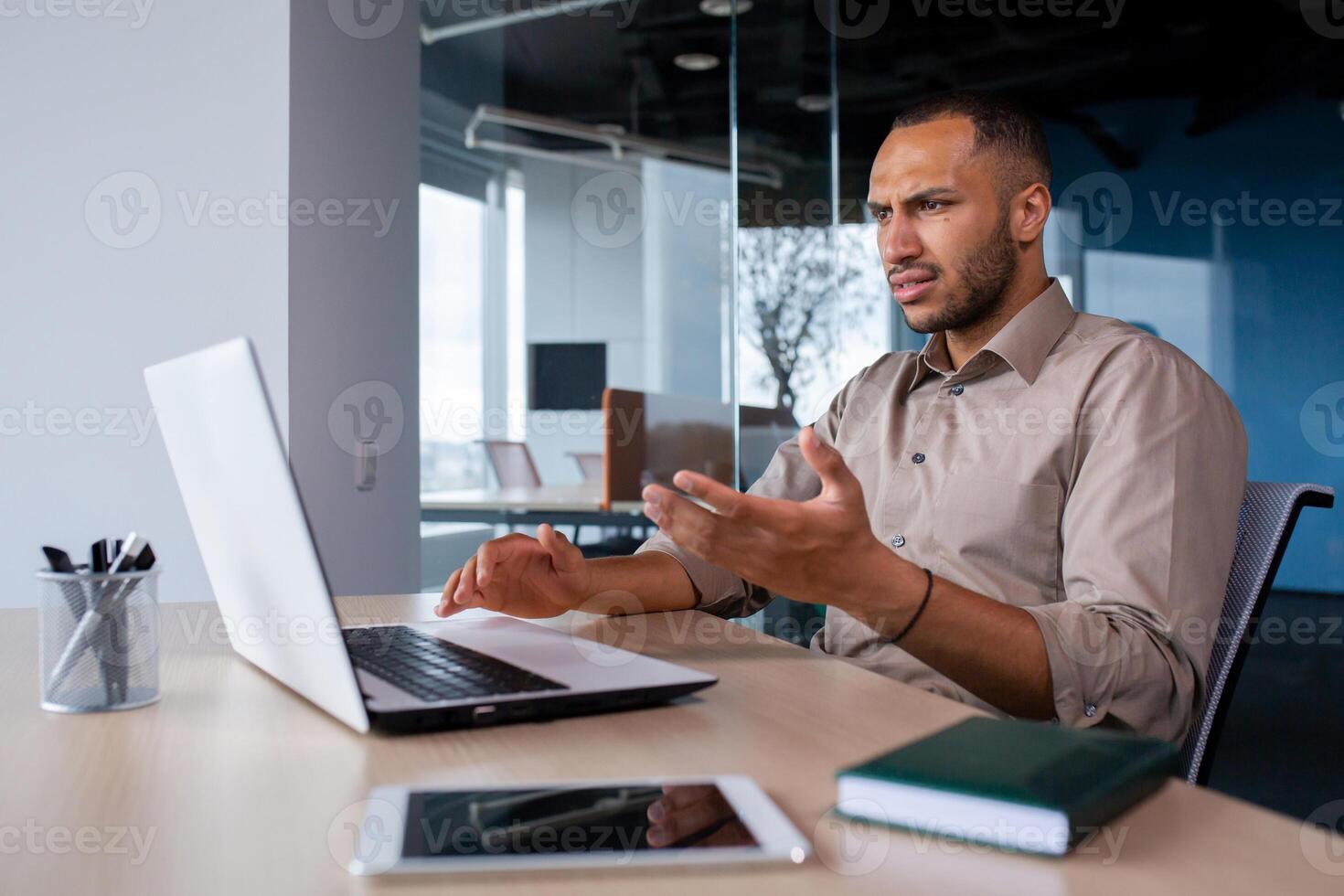 Upset frustrated businessman looking at laptop window, man received online notification message with bad achievement results, workplace error. photo