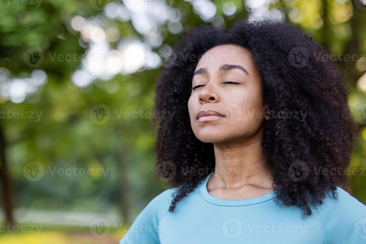 Woman embracing mindfulness in tranquil outdoor environment, eyes closed in peaceful meditation. Connection with nature promotes relaxation and inner peace, enhancing mental well-being photo