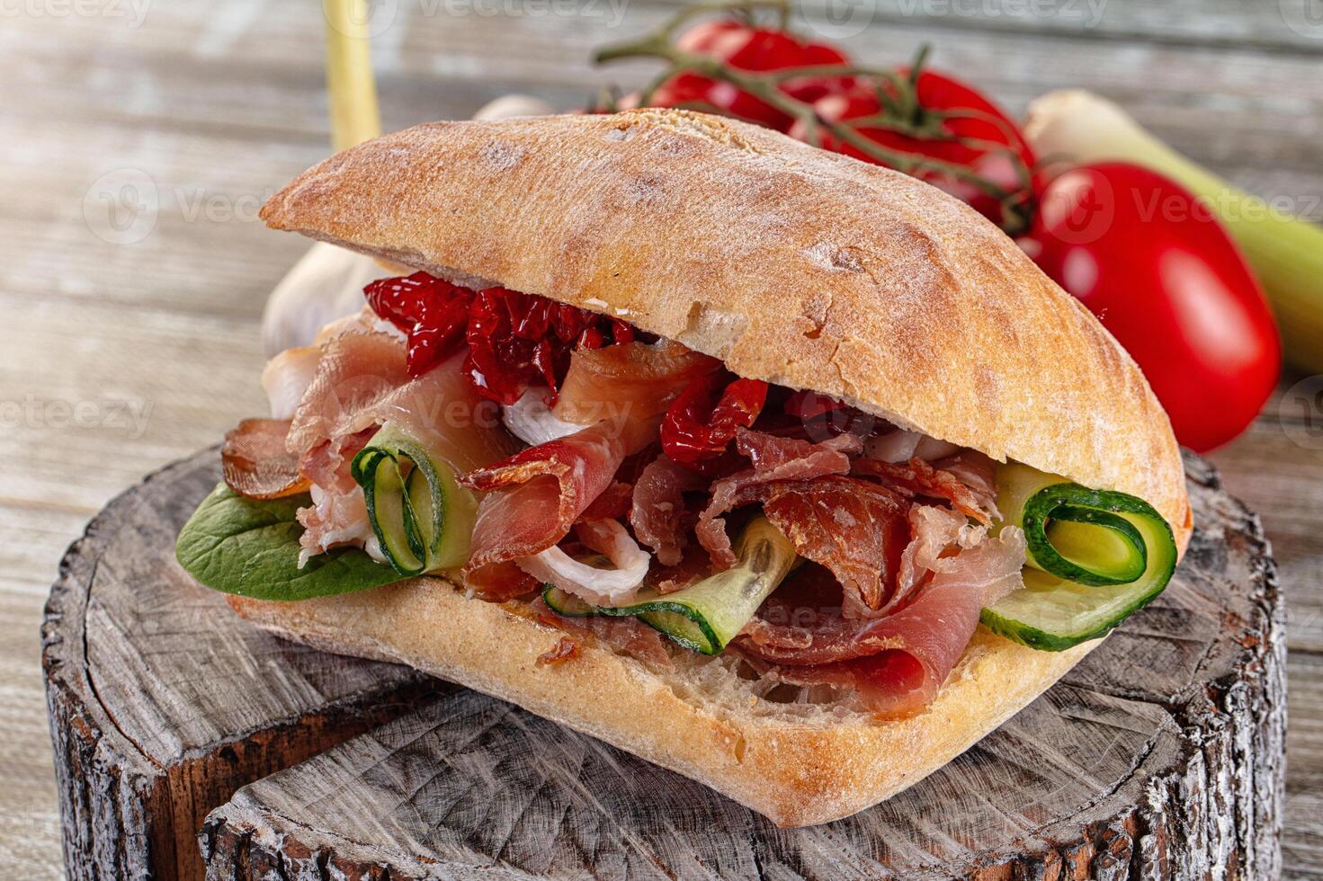 A sandwich on a wooden table photo