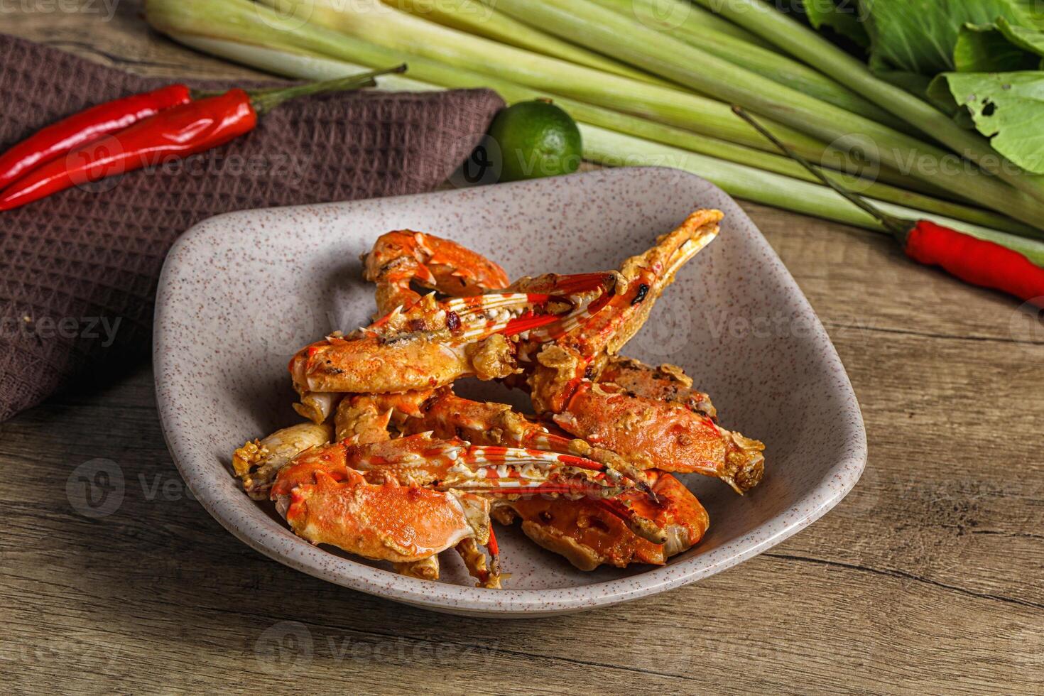 A bowl of food on a table with a plate of food photo