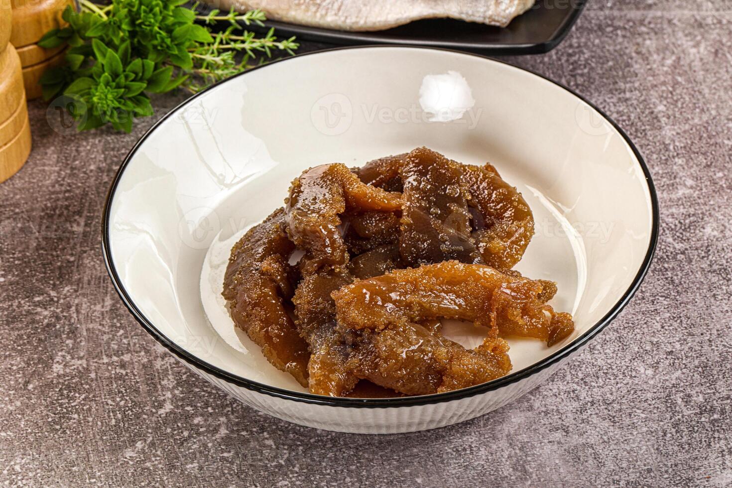 A bowl of food with some meat in it photo