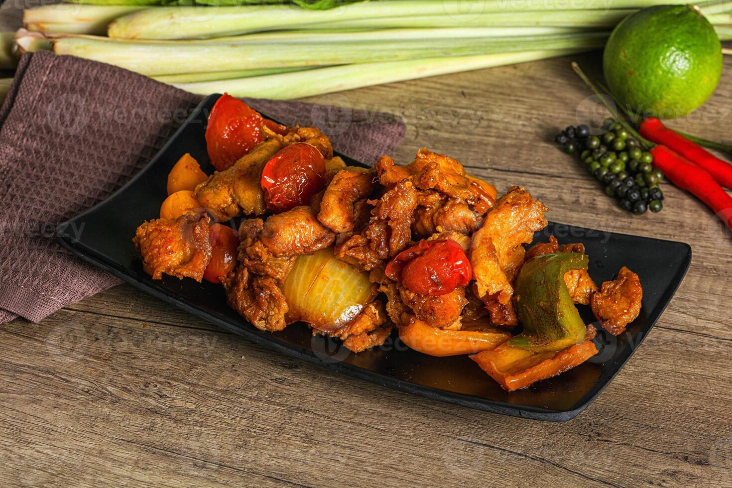 A plate of food with vegetables and chicken on it photo
