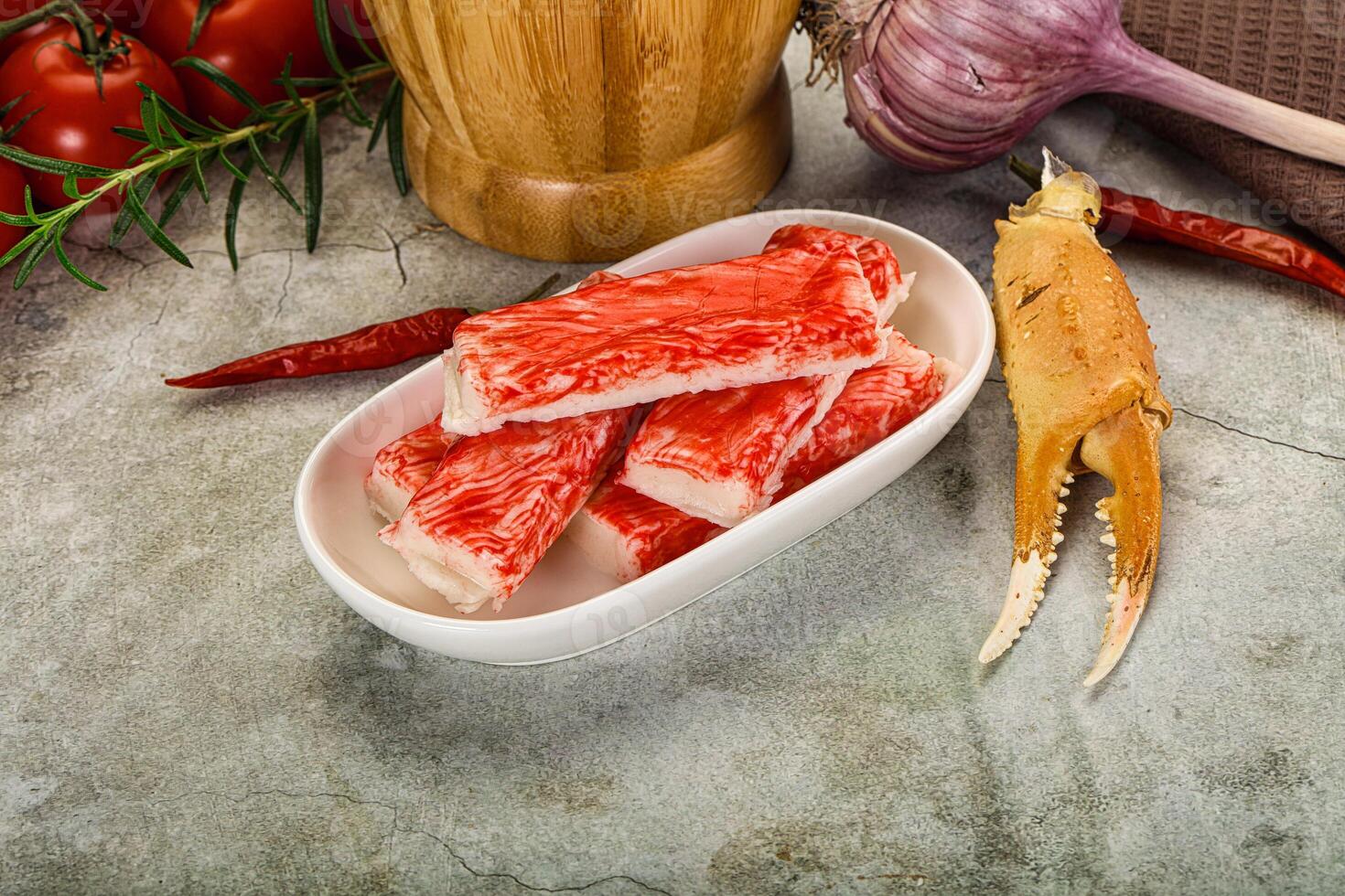 Raw crab meat in a bowl with tomatoes and garlic photo