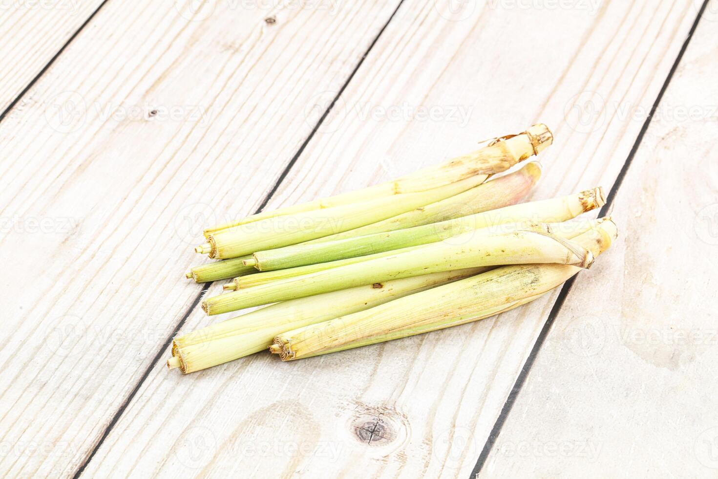 A bunch of green celery on a wooden table photo
