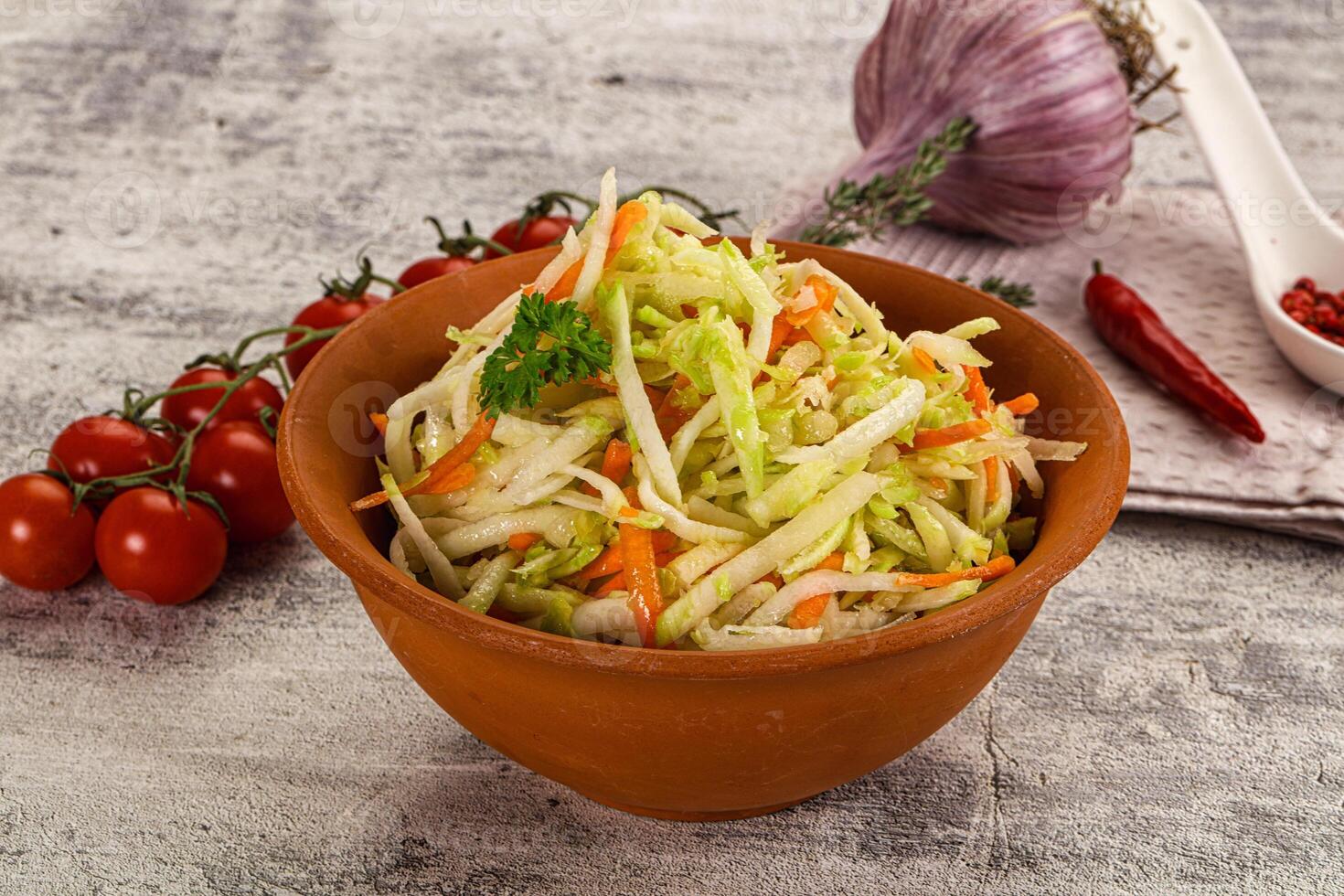 A bowl of salad with tomatoes and onions photo