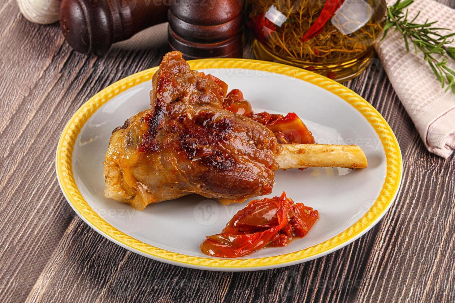 A plate of food with a meat on it photo