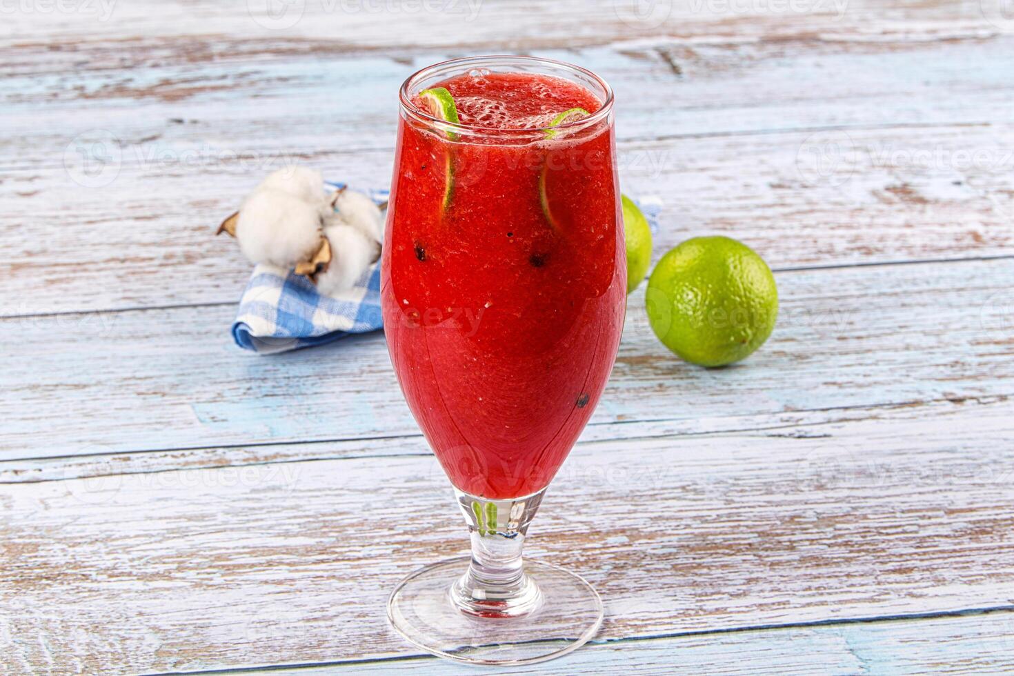 A glass of red drink photo