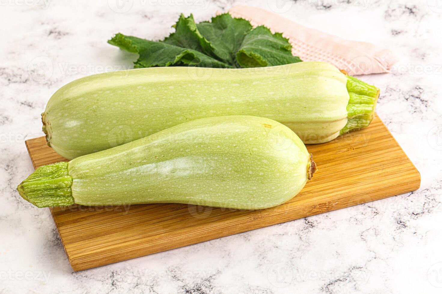 Two squash on a cutting board photo