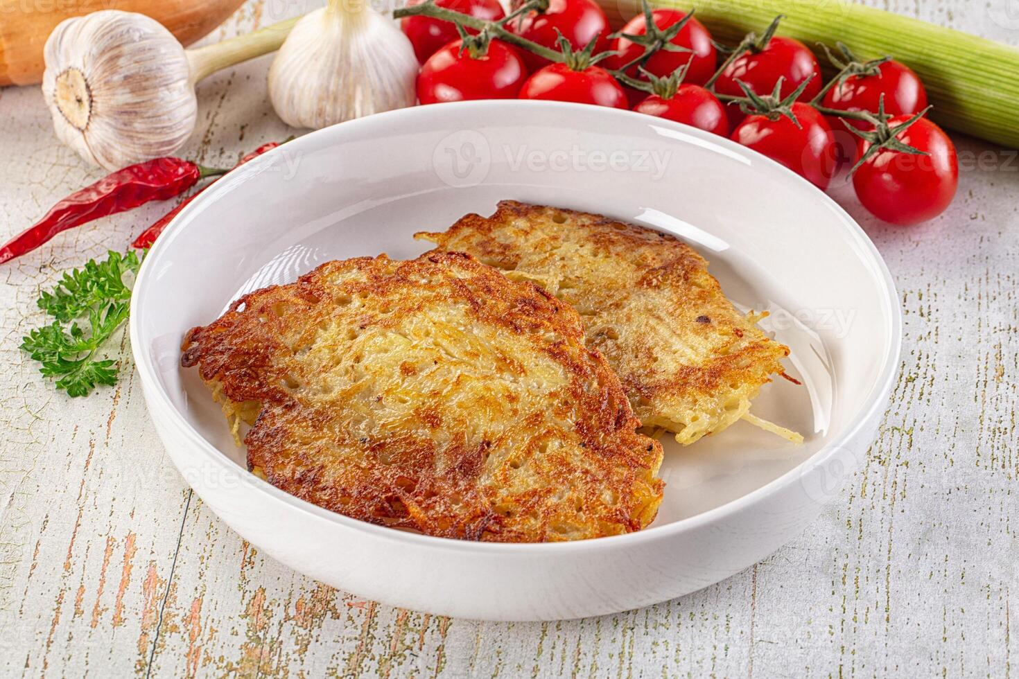 A white bowl with two pieces of food in it photo