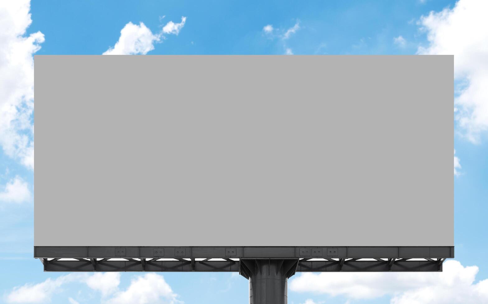 Gray screen on pole outdoor billboard with blue sky background photo
