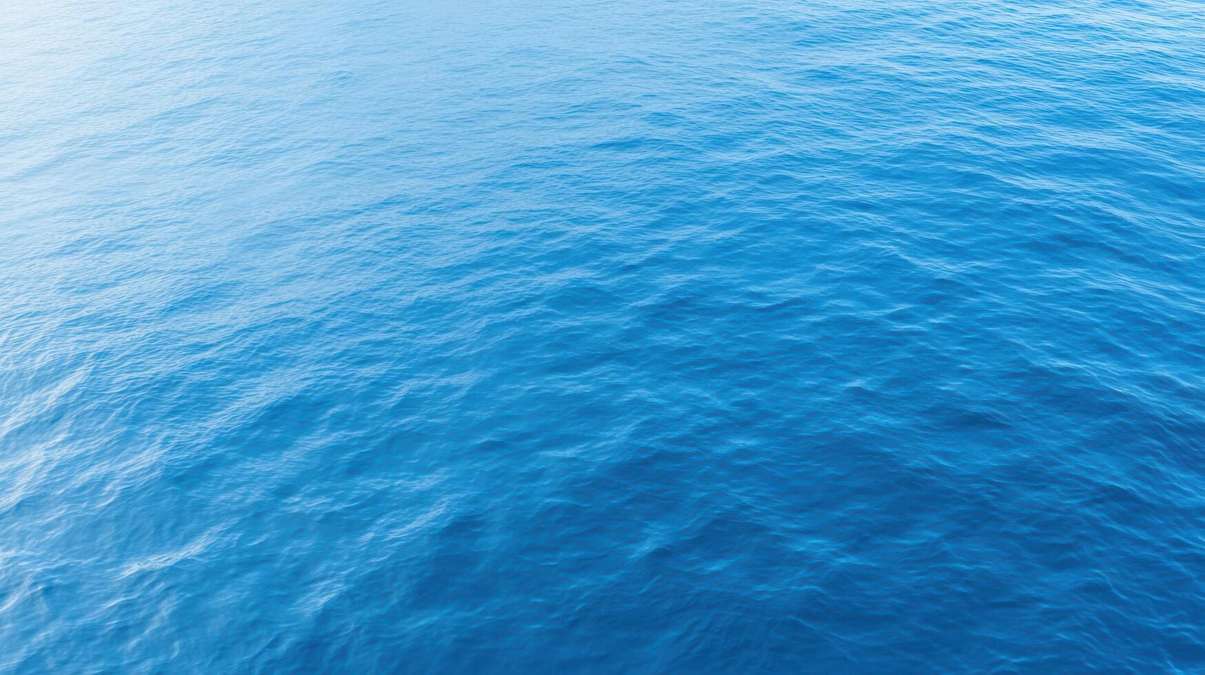 Calm ocean surface with gentle waves reflecting sunlight, creating serene atmosphere photo