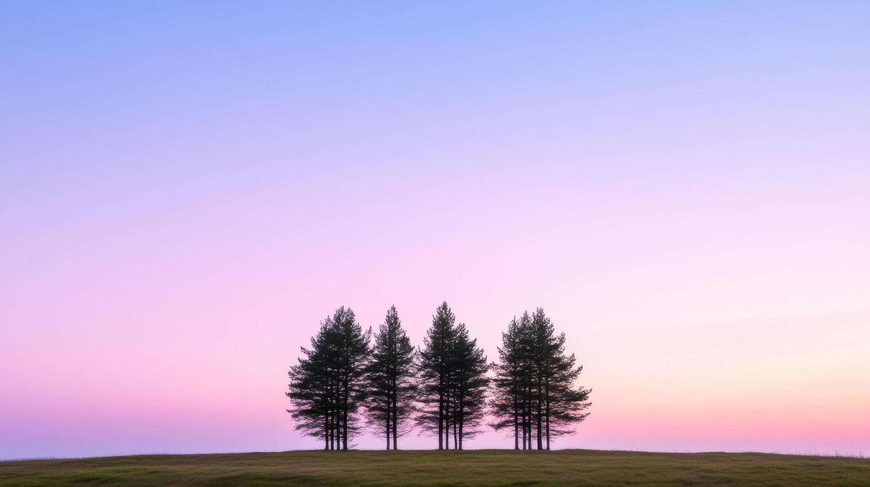 Silhouetted trees against soft purple and pink twilight sky create serene atmosphere photo