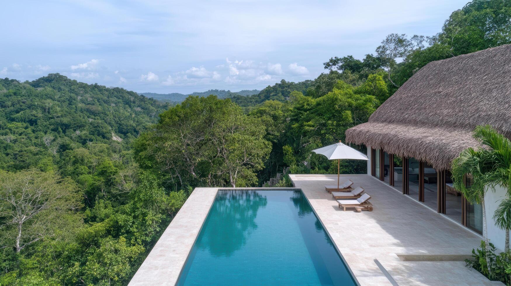 A pool in front of a thatched roofed house photo