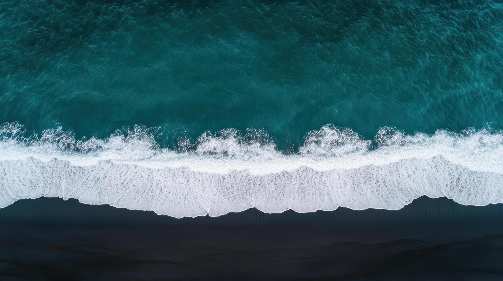 An aerial view of the ocean and waves photo