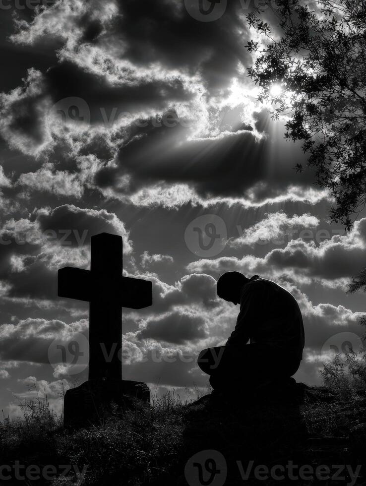 Contemplative moment at the cross during sunset photo