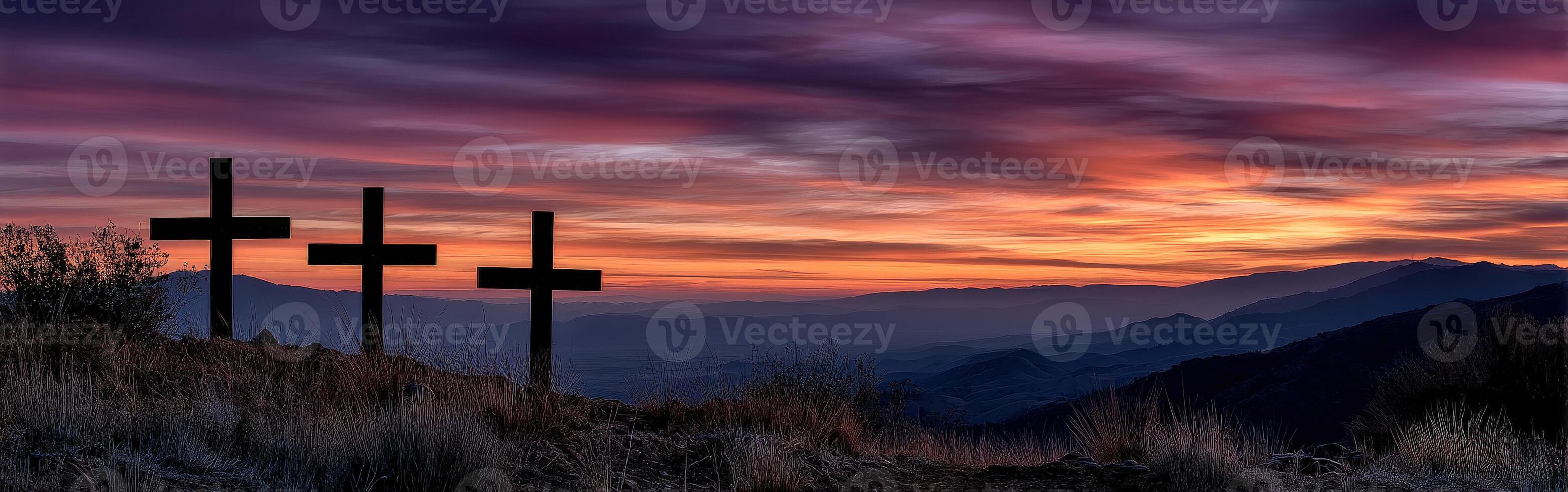 Sunset over three crosses on a hillside in a tranquil landscape photo