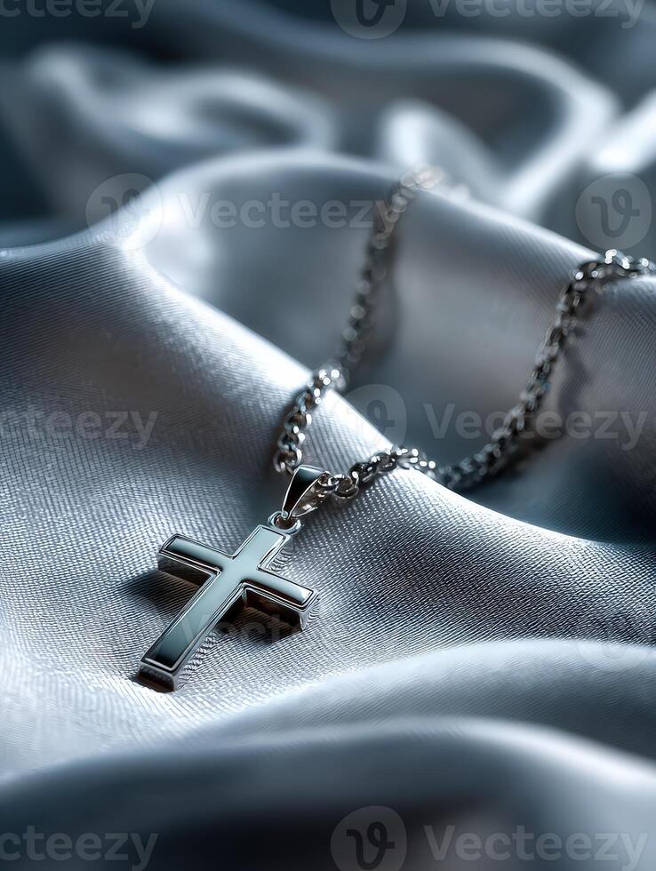 A silver cross on a silver chain photo