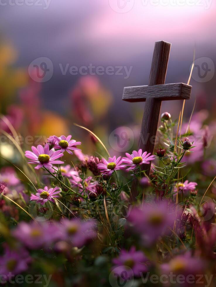 Wooden cross in flower field photo