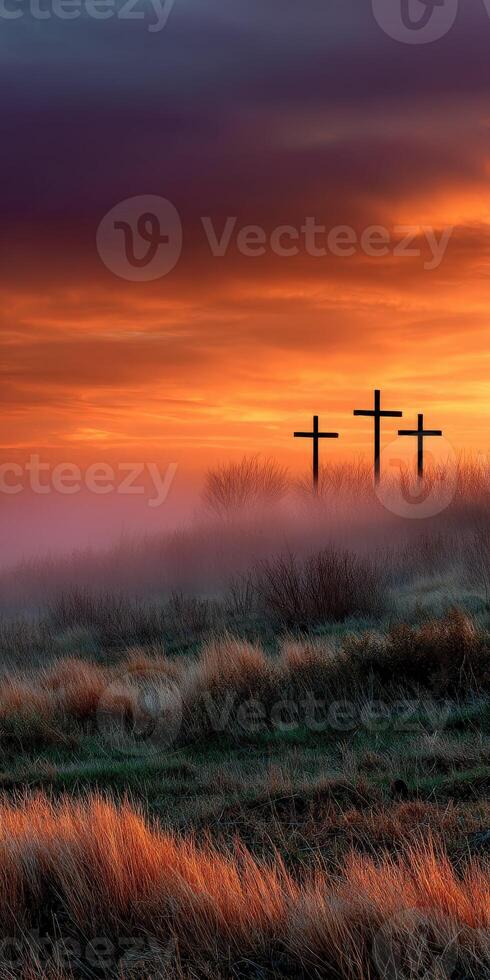 Serenity at dawn with crosses in the foggy landscape photo