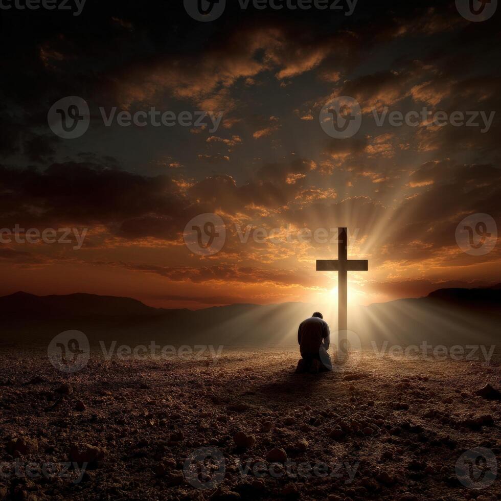 Prayerful reflection at sunset near a cross photo