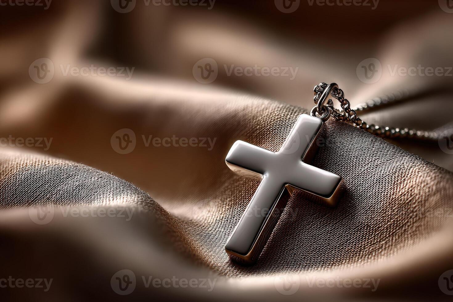 A cross pendant on a leather surface photo