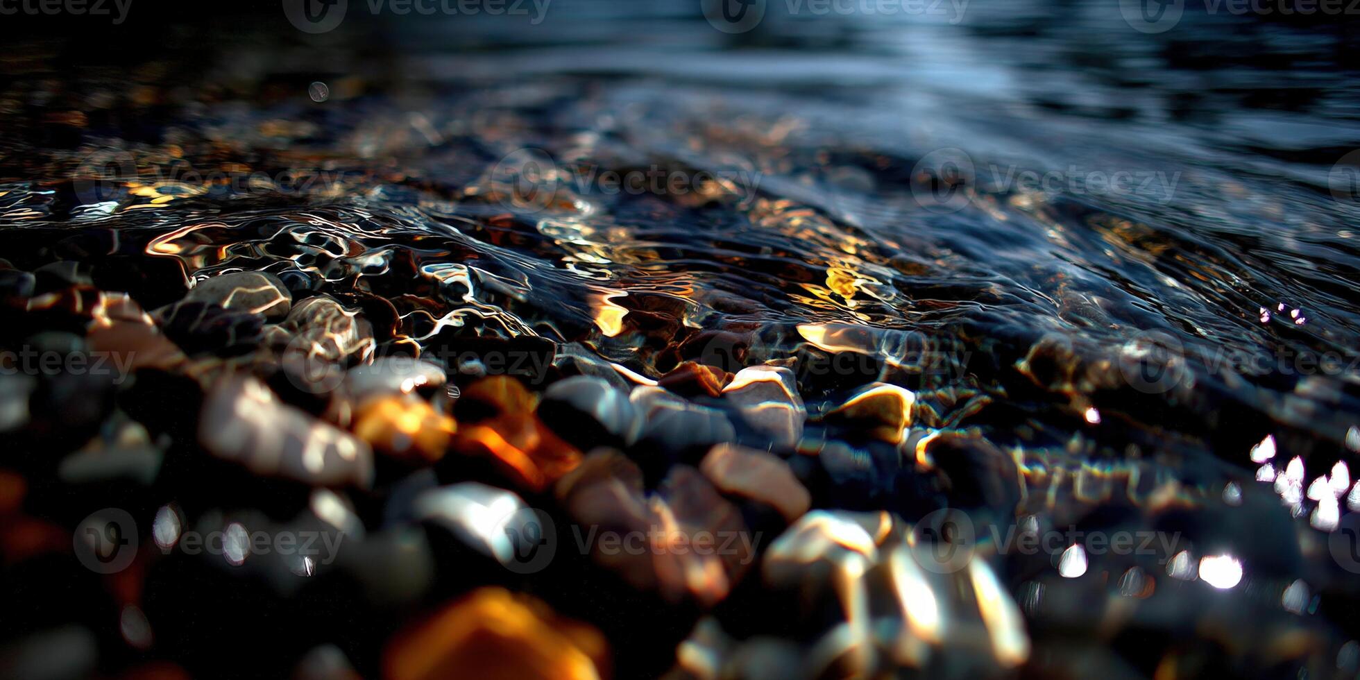 Colorful pebbles submerged in crystal clear water photo