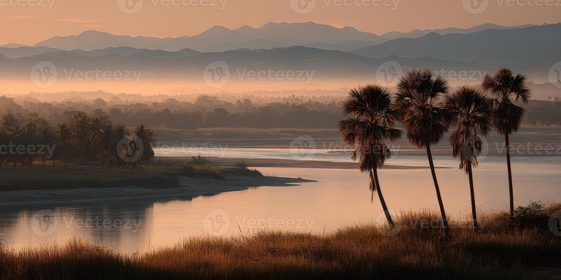 Scenic riverside view at sunrise with palm trees and mountains photo