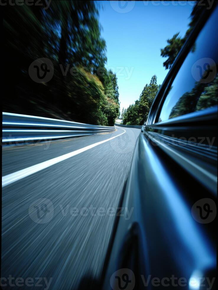 A car driving down a road with blurry images photo
