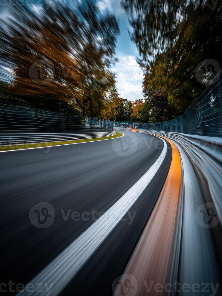 Curving racetrack with blurred motion in autumn landscape photo