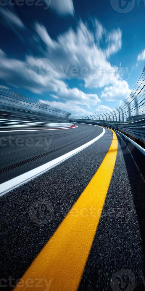 Race track curves under blue sky and clouds photo
