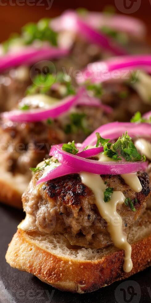Savory meat sandwiches with onion and sauce garnishing photo